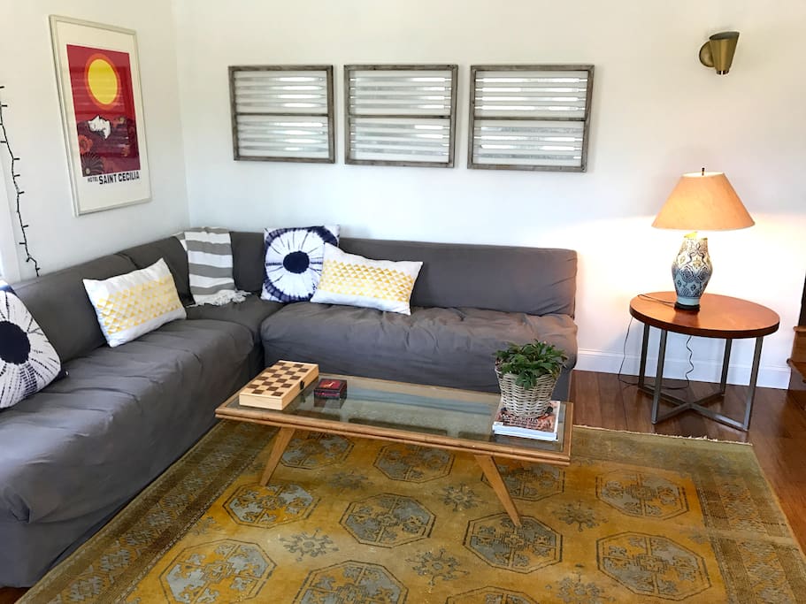 living room couches look out over deck