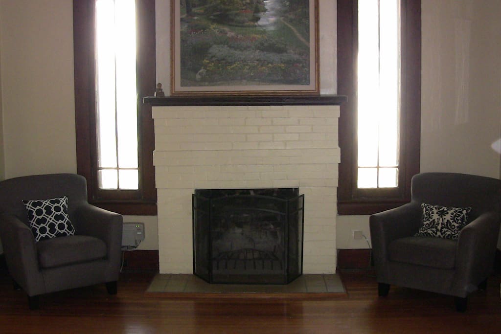 The working fireplace provides a cozy nook for conversation and reading.