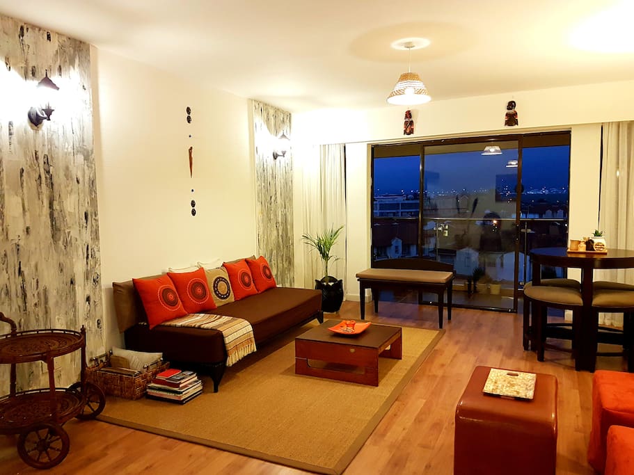 Relax in the elegant, spacious living room while taking in the lovely view outside.