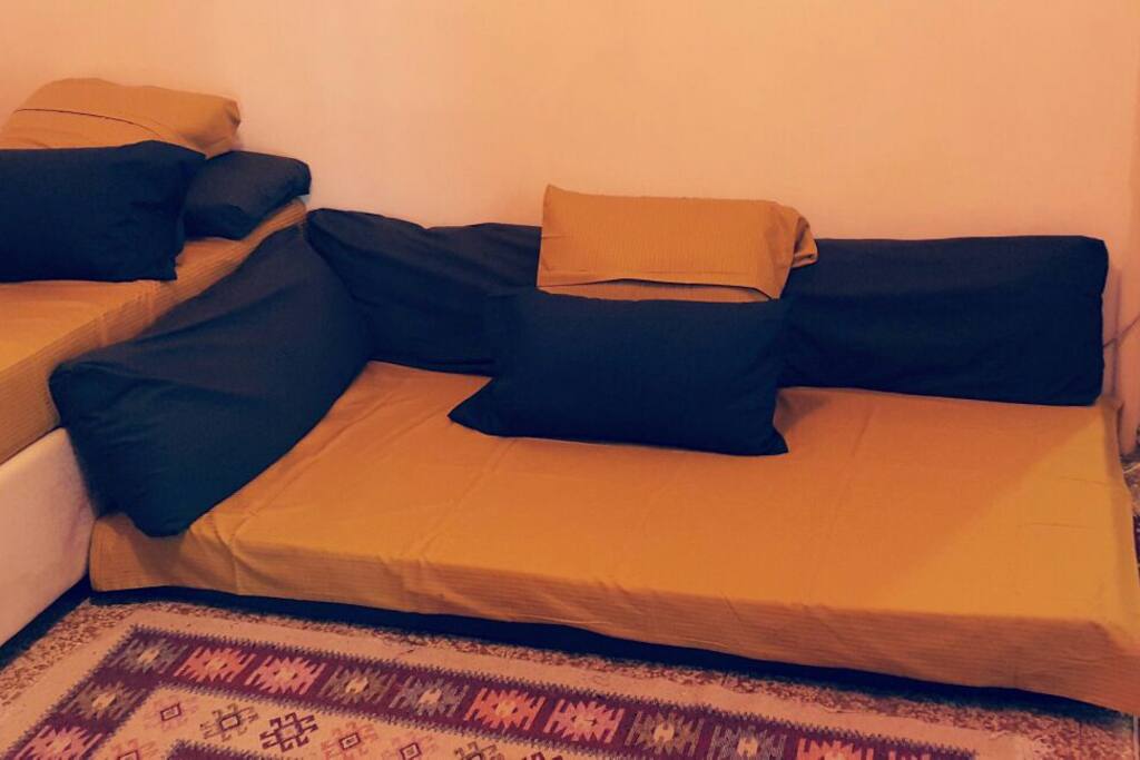 one single bed with another floor lounge single bed ( it fits two when it's needed ☺ ) and a matress for an extra guest