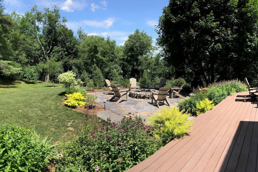 Private backyard with fire pit, Big Green grill, hot tub, deck, and trail to Connecticut River