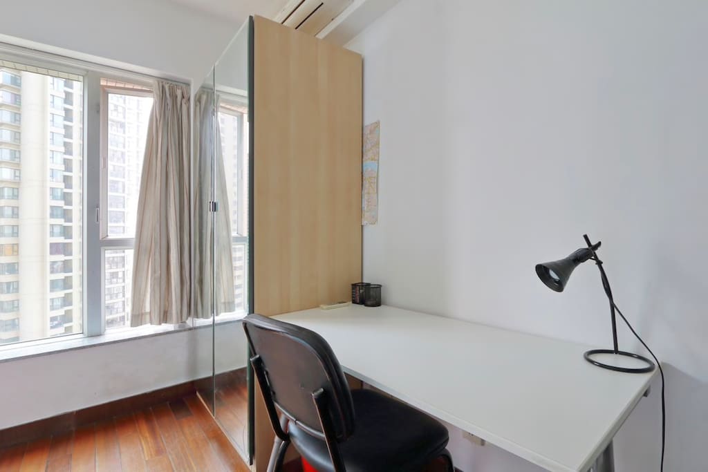The room C you'll be living in with a double bed, a desk, a wardrobe and nice view