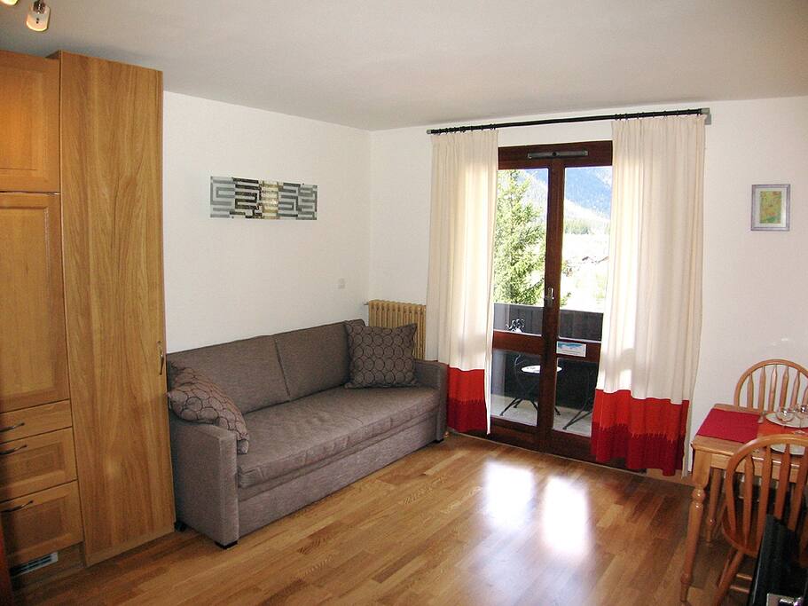Comfortable sofa convertible to two single beds.