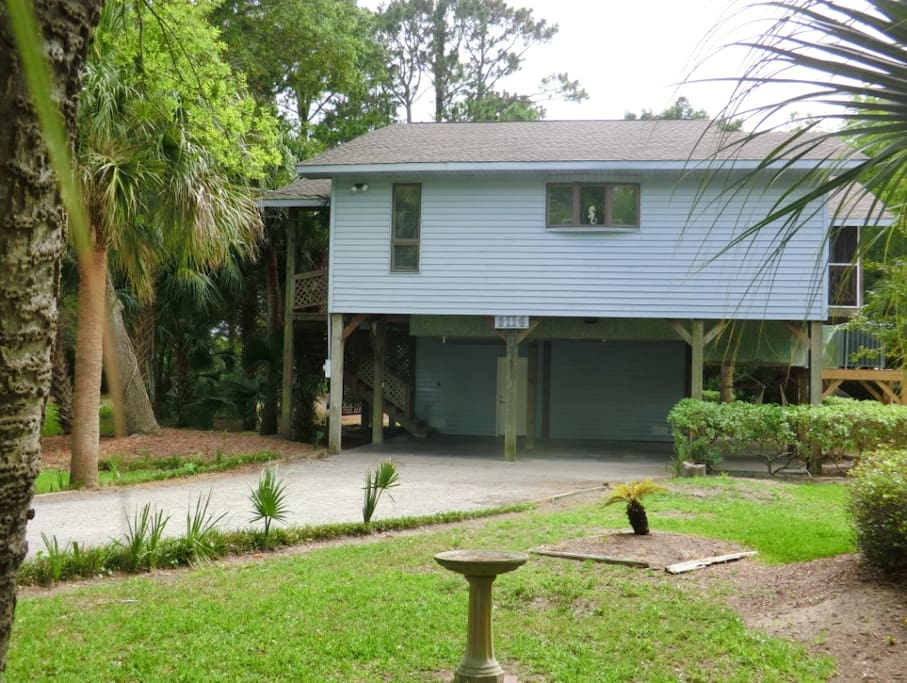 Front of House with Covered Parking and Long Driveway