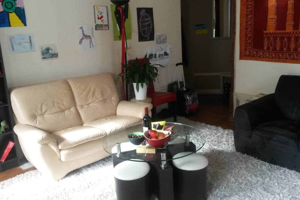 Living room, at the center of the apartment, with a small table great for children.