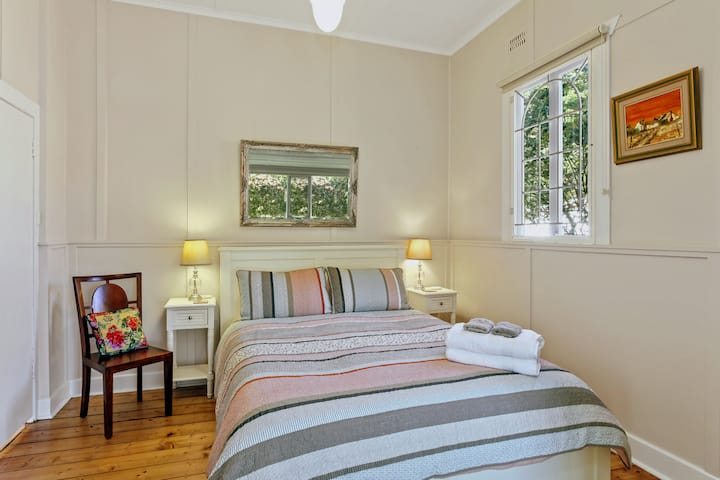 Master Bedroom with foliage reflected from the view to the street