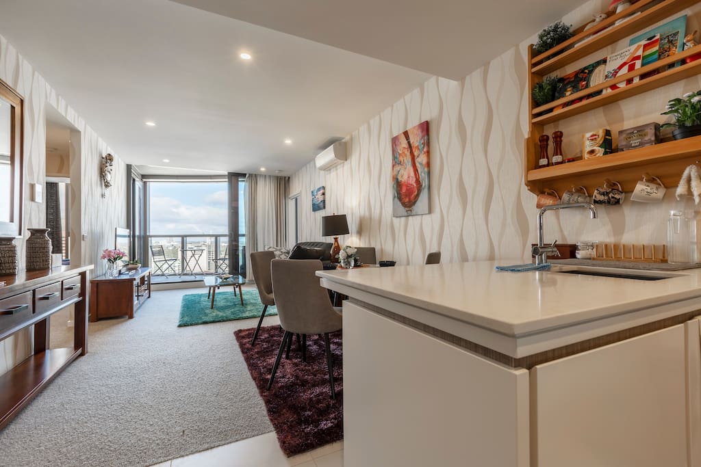 Brand new, sub-penthouse level apartment with luxurious interior design, high-end configuration, brand new furniture , utensils and spectacularly unobstructed views across Albert Park Lake and oceans