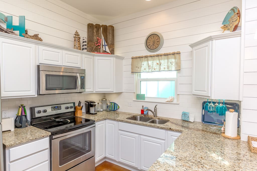 Updated kitchen with stainless appliances and lots of cookware and dishes for your vacation meals.