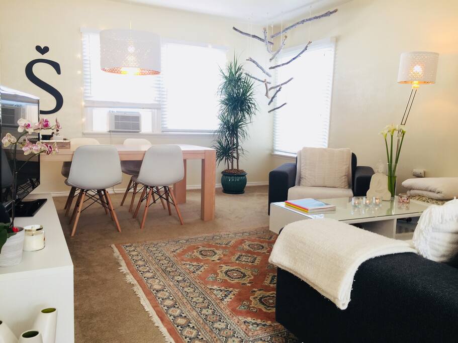 Boho beach decor with vintage rugs.