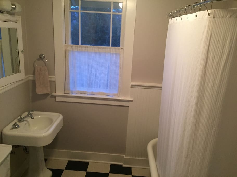 Fully renovated bath with claw-foot tub and full-height shower