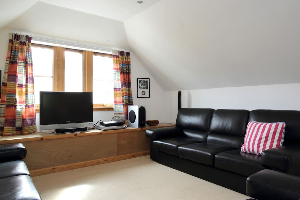 Cable TV, sofas and chairs.