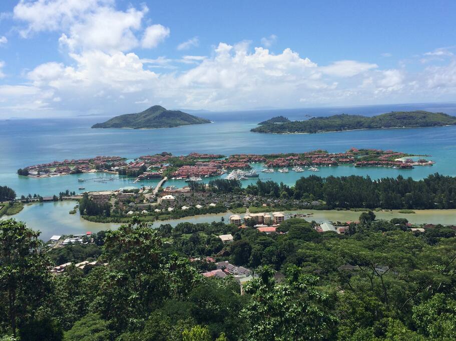 View point from Mahe mainland, overlooking Eden Island with it's access bridge. Saint Anne Island can be viewed in the distance on the left, with Surf Island on the right.