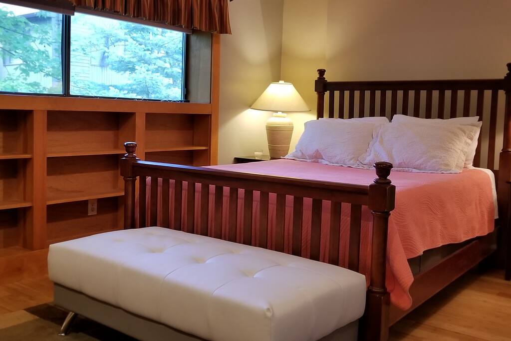 large master bedroom with Queen Bed and 42" TV and master bath