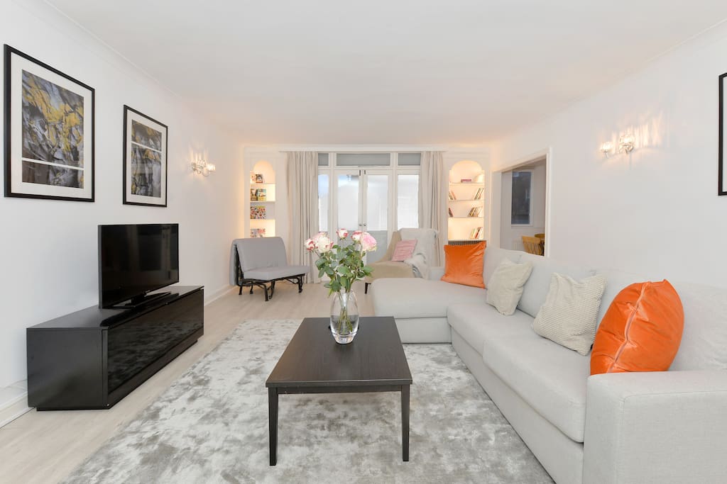 The spacious Lounge with L shaped sofa, armchair, flat screen TV, Freeview channels, Free WiFi and more
