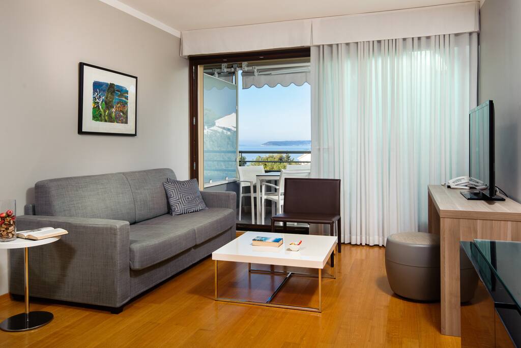 Comfortable double sofa with telephone (external calls and hotel services)