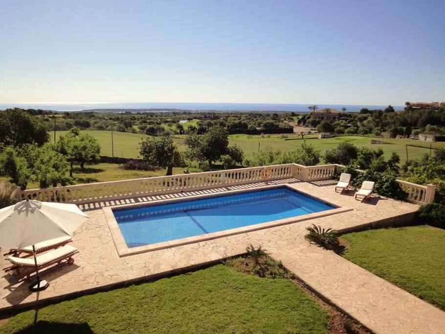 View from the terrace to the pool and the sea