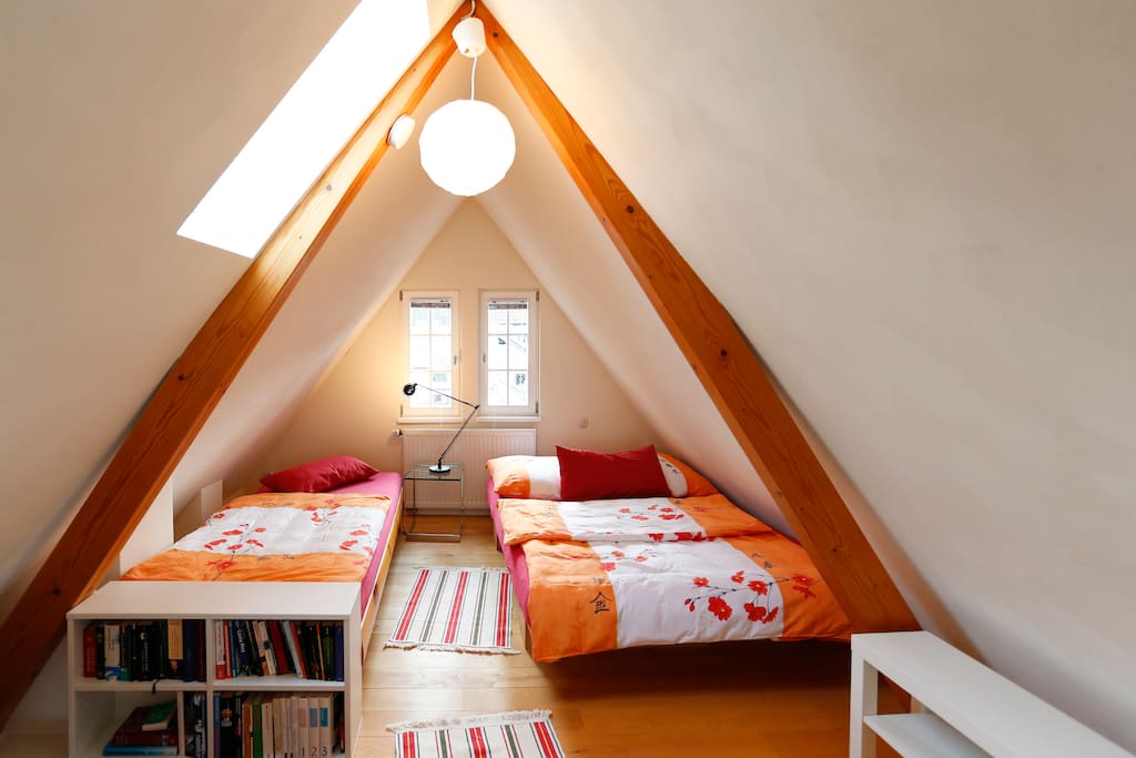 The bedroom is located in the second floor roof-studio