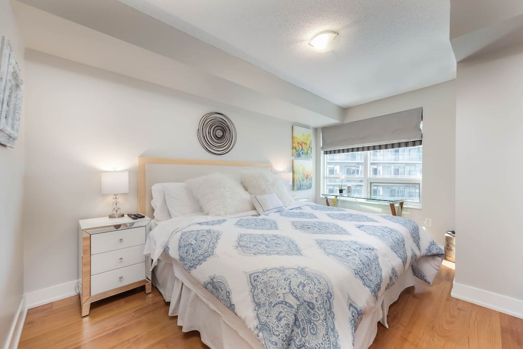 Master bedroom features a view of the city