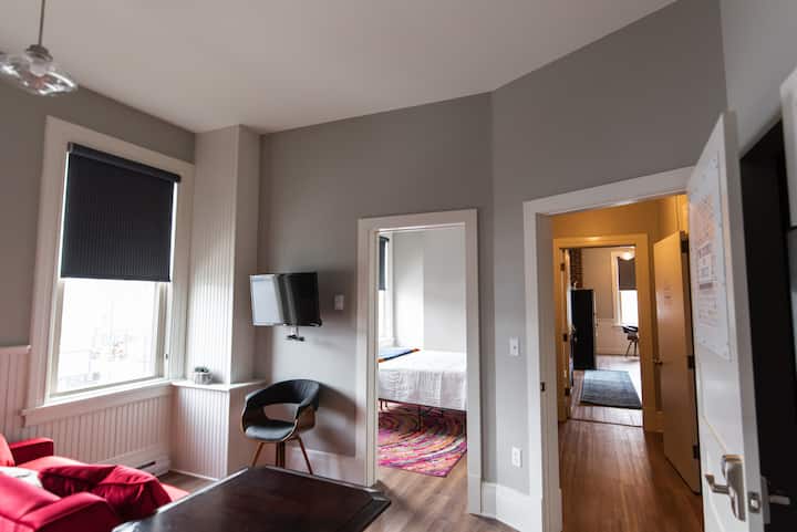 Living/Kitchen area looking into bedroom 