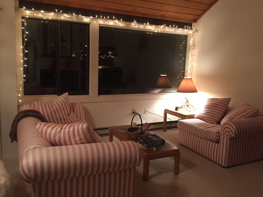 The living room - sorry about the weird colored furniture. We have plans to get it reupholstered soon. View of the mountains from the large window.