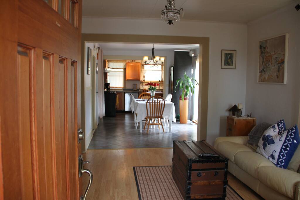 Open the Front Door and look from the Living Room to the Dining Area to the Kitchen