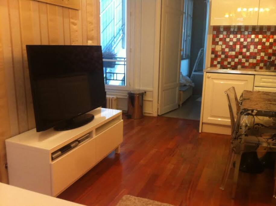 Convivial living-dining area with parquet flooring
