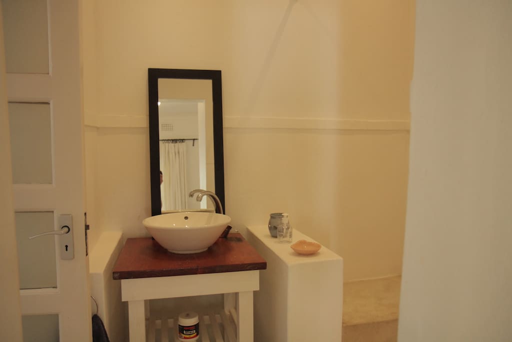 Hand basin. The shower is on rhs and the separate toilet is on lhs. The toilet door closes it off so it is private