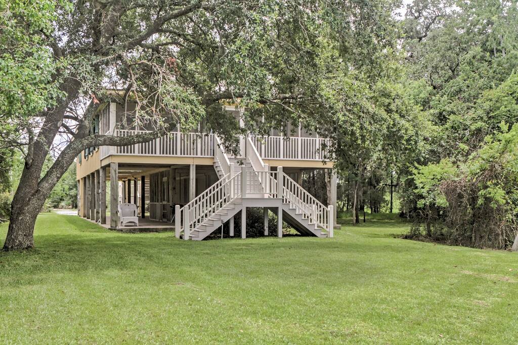 The home offers a pier, screened-in porch, and plenty of outdoor space to enjoy the scenic views.
