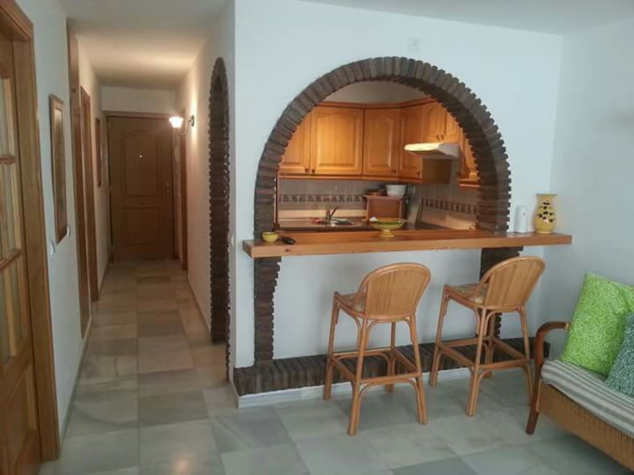 Hallway and Breakfast bar with 2 high stools
