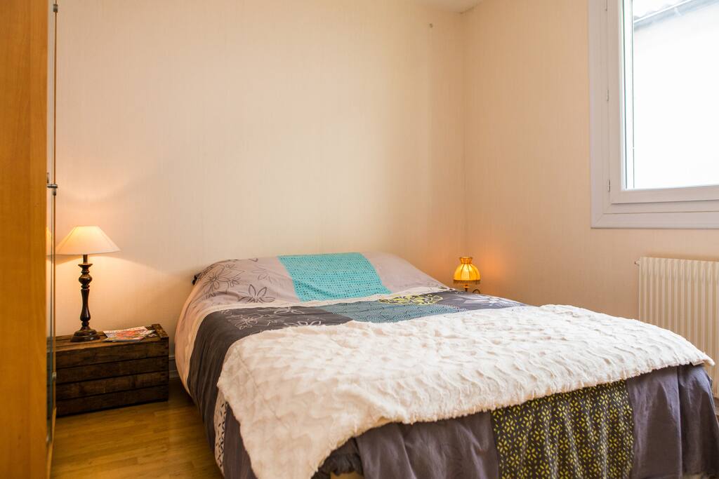 Sunny bedroom with large windows