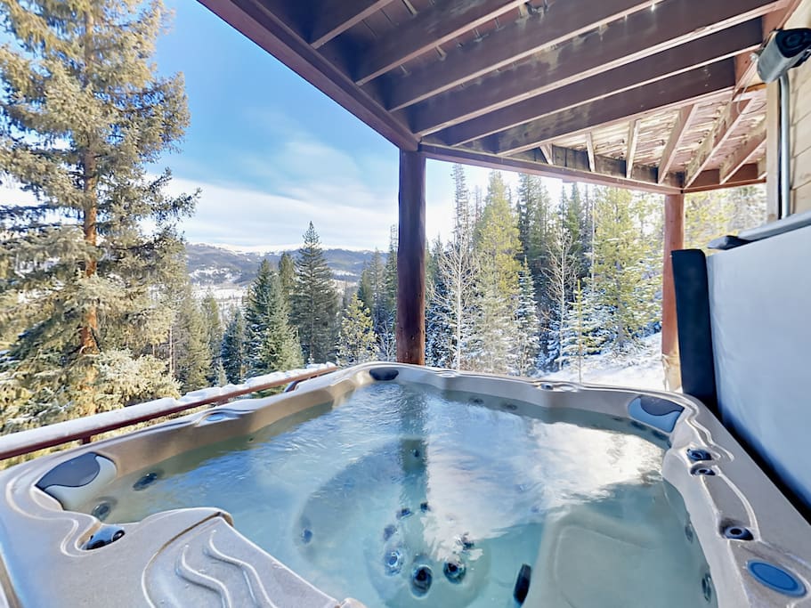 Soak in the 7-person hot tub offering expansive views of the continental divide.