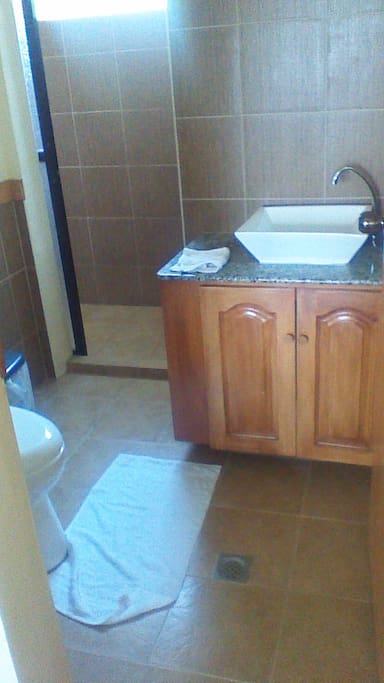Clean, private bathroom with shower