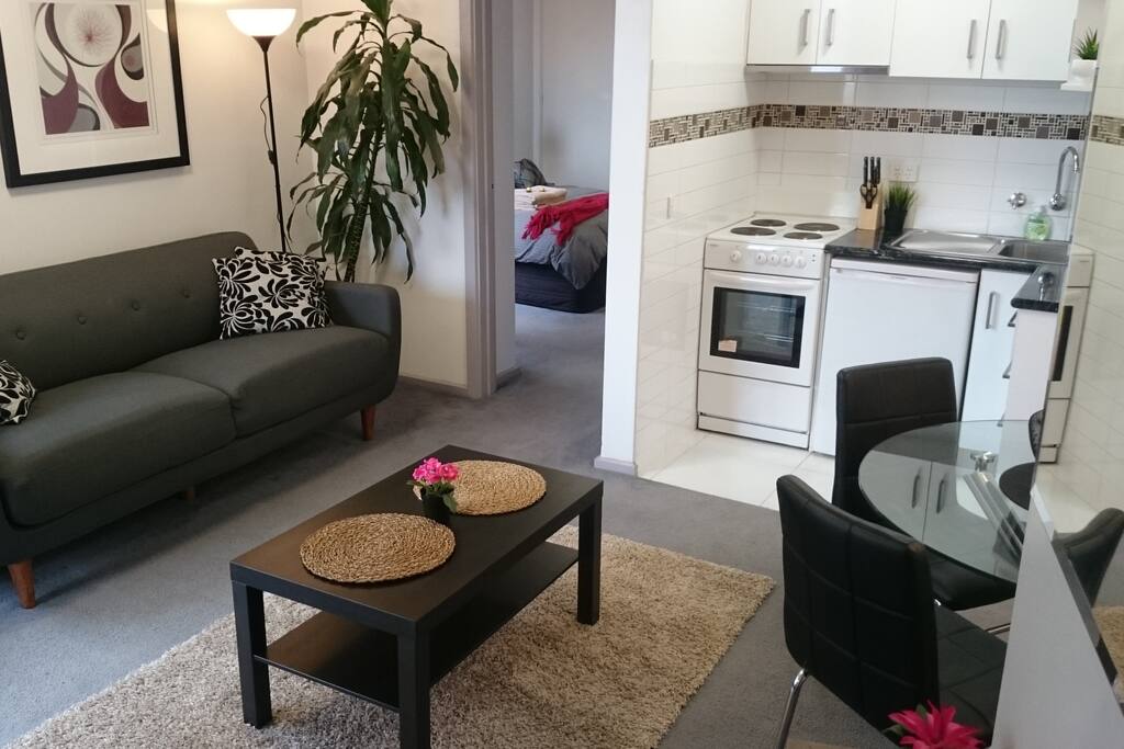 Living area with access to bedroom and kitchen