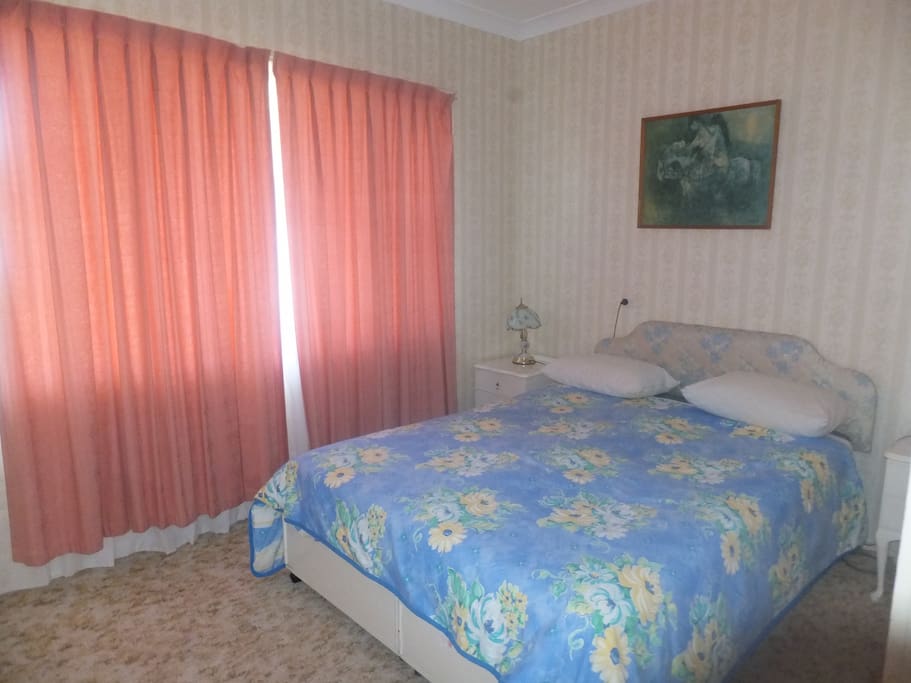 large room with queen bed