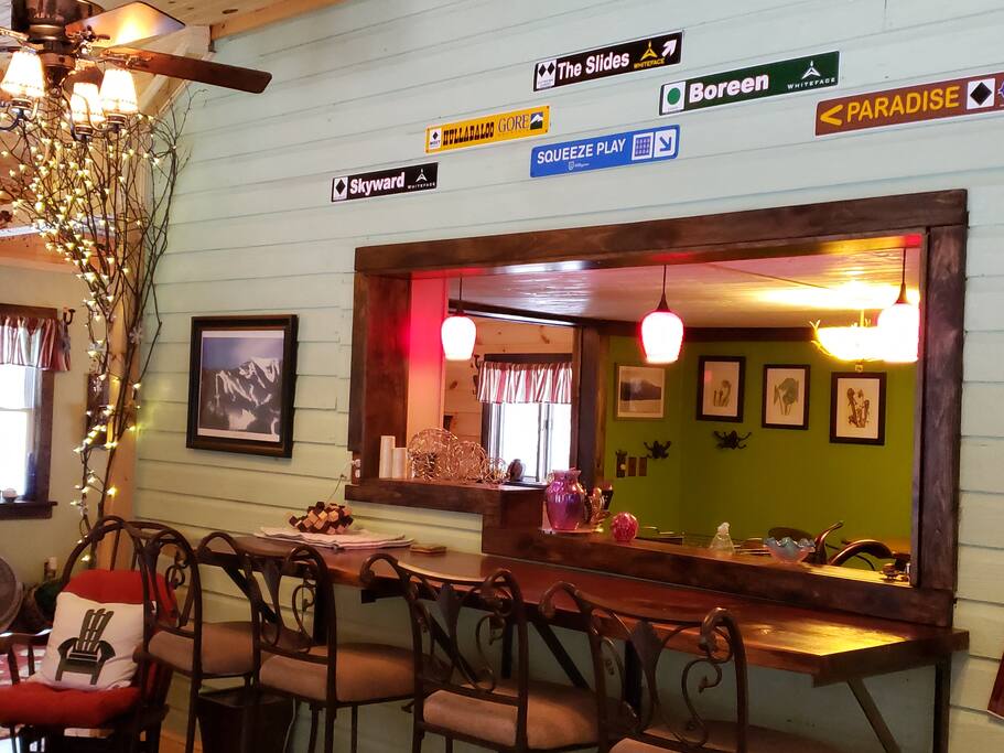 Walnut bar has seating for 4
