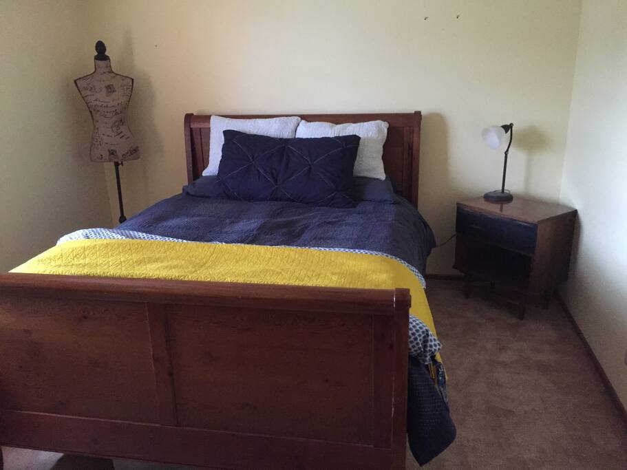 Comfy bedroom includes queen sized sleigh bed, nightstand & dresser, closet for storage, ceiling fan with lights. Linens and towels included. Locked door. Wfi