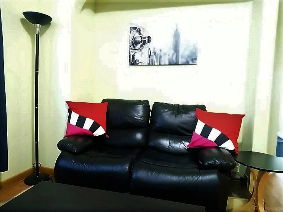 Living room has TV offering HBO and movie channels.