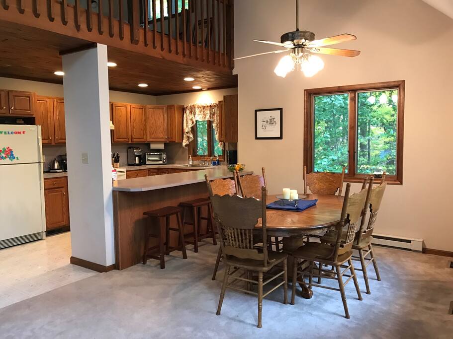 Kitchen and dining room with loft above