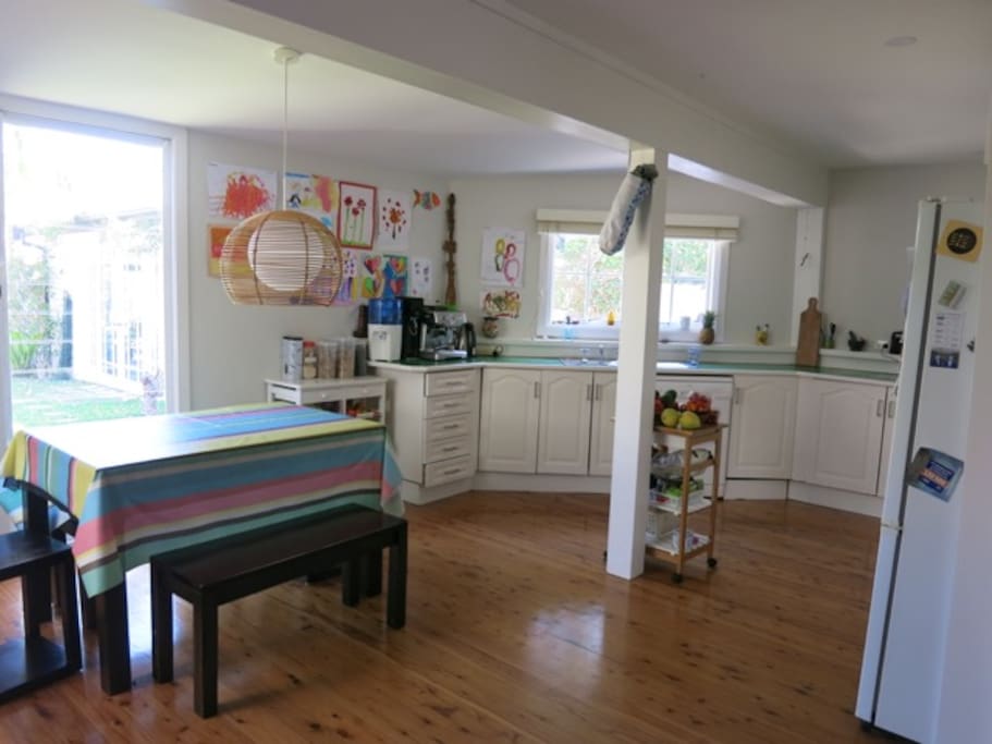 Spacious kitchen with multiple appliances including barista style coffee machine