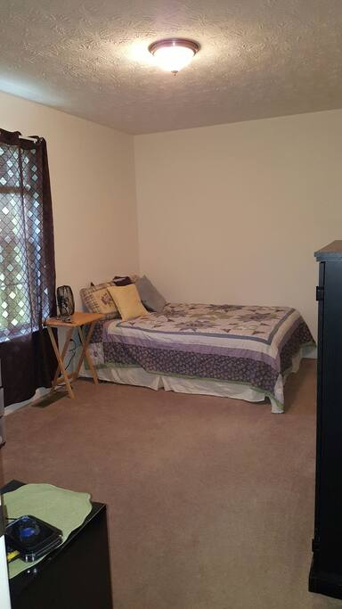 This bedroom has a full sized bed, desk, and TV with BluRay & Netflix.