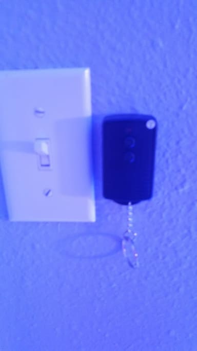 The remote on the wall controls the blue lighting which can be turned on and off.