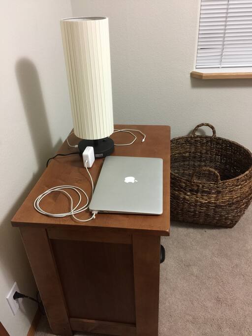 Dresser with USB charging port and 110 outlet.