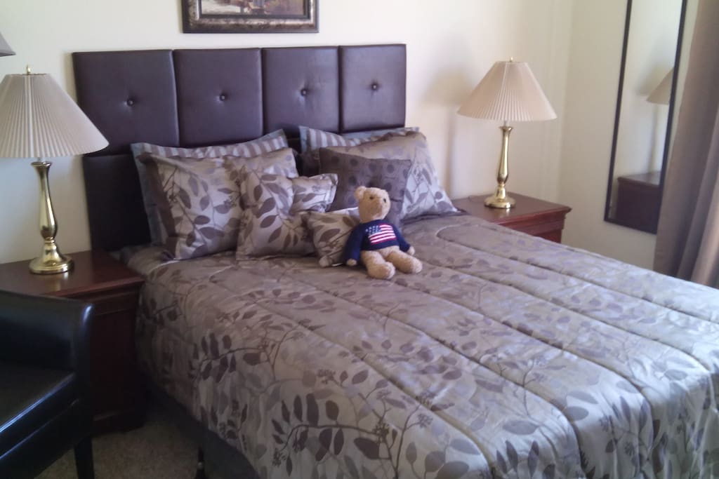 New bed with luxurious bedding and 100% cotton sateen sheets. Comes with bear for company!