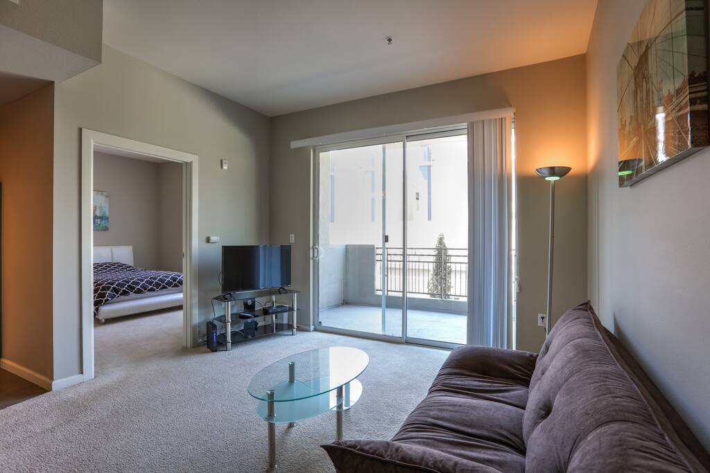 This spacious living room has great outdoor lighting.
