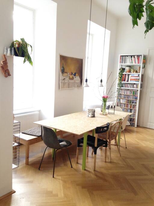 view from the kitchen into living room - enough seats to eat for 12