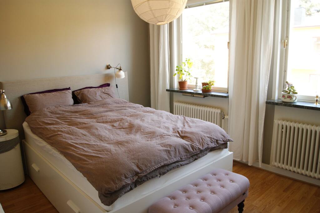 Bedroom with a double bed and two dressers