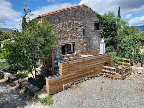 Small bright stone house in a farmhouse