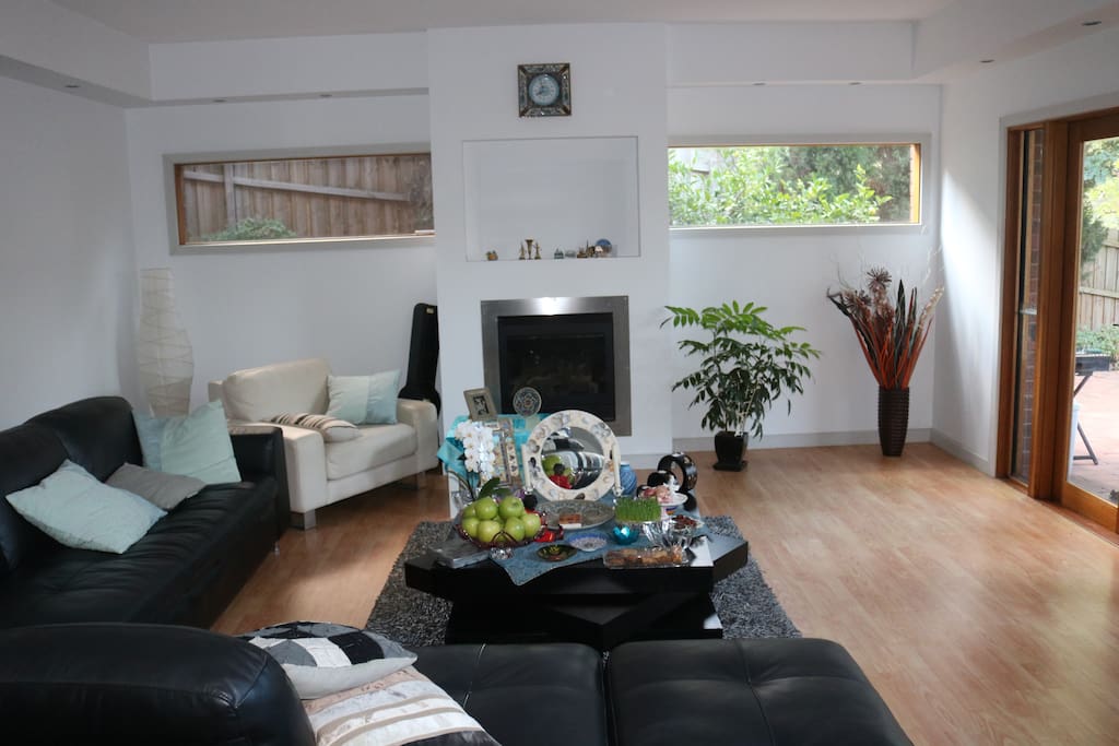 Spacious and bright private room with two big sofas and one queen size inflatable mattress