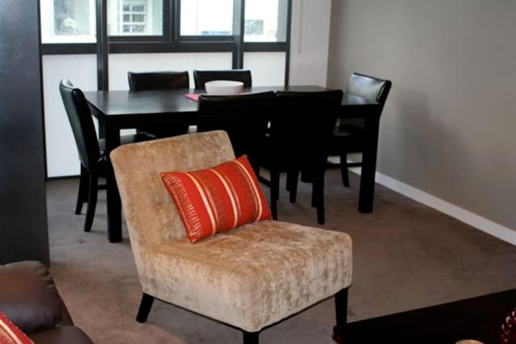 Comfortable furniture and six seat dining table.