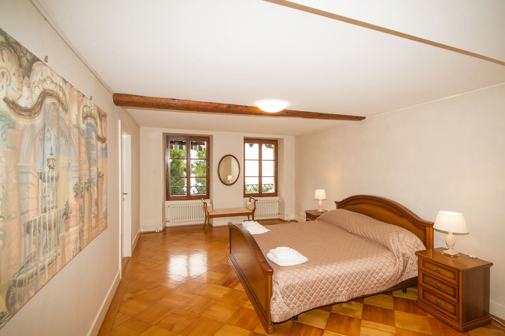 Bedroom #2 is 25m2 with king bed and overlooks garden and lake